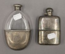 A silver mounted hip flask and a plated hip flask. The former 14.5 cm high.
