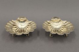 A pair of silver shell form salts. 11.5 cm wide. 10.9 troy ounces.