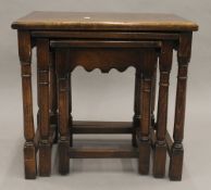 An oak topped nest of three tables. 51.5 cm wide.