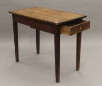 A 19th century oak side table. 91 cm wide.