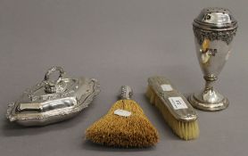 Two silver brushes, a plated castor and a small plated entree dish. The castor 16 cm high.