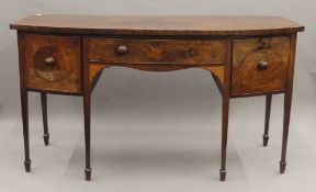 A 19th century mahogany inlaid bow front sideboard. 178 cm wide.