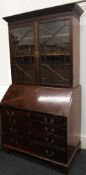 A 19th century mahogany bureau bookcase. 210 cm high x 112 cm wide.