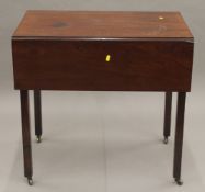 A 19th century mahogany Pembroke table. 48 cm wide flaps down.