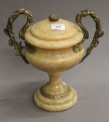 A gilt metal mounted twin handled urn. 29 cm high.