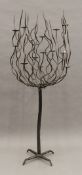 A modern wrought iron standing candelabra. 165 cm high.