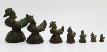 Seven bronze opium weights depicting birds, largest 6.5cm, smallest 0.6cm