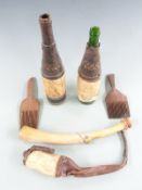 Nigerian tribal items from Bonny area circa 1900, including carved bone (musical) horn, combs,