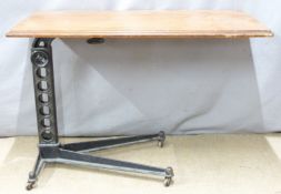 A mahogany and cast iron adjustable invalid's table, 46 x 81cm