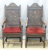 A pair of Victorian upholstered carved oak hall chairs