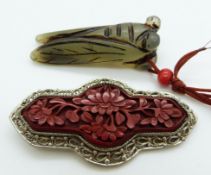 Chinese filigree brooch set with cinnabar lacquer (6cm) and a jadeite locust, length 5cm