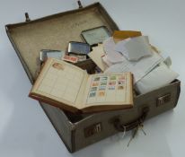 A suitcase of loose GB, Commonwealth and foreign stamps and a Lincoln stamp album