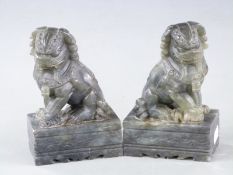 Pair of Chinese serpentine Foo dogs, 12.5cm tall