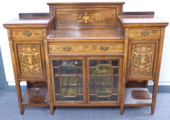 A late 19thC inlaid rosewood sideboard having central drawer with bevelled glazed doors below,