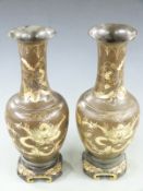 A pair of Japanese Meiji period lacquer pedestal vases decorated with gilt dragons, H42cm
