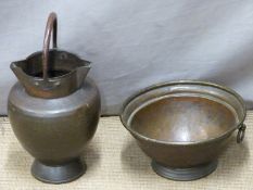 19th/20thC Arts and Crafts hammered twin lipped jug with riveted handle, with a similar pedestal