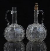 A pair of 19thC Dutch glass decanters engraved with scenes of birds and foliage, each