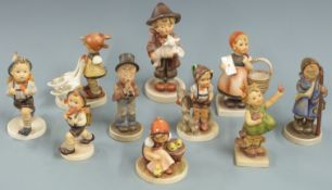 Ten Goebel Hummel figures including horn player