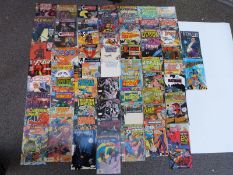 Sixty-five DC comics including Catwoman, Superboy, Wasteland, The Flash, Superman & Firestorm,