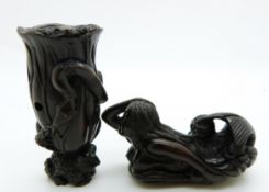 Japanese dark wood netsuke depicting a small frog carrying a tree trunk with another frog on the