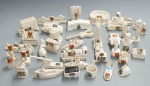 A collection of crested ware including Wembley Stadium, City of London, Carlton railway engine,