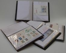 Four albums of first day covers and an album of booklets, presentation packs, miniature sheets and
