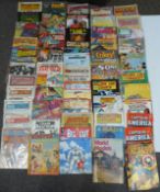 A large collection of comic books and magazines including Captain America, Mad, Big Guy, Buster,