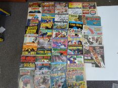 A large collection of comic books and magazines including Comic Book Marketplace, Solo, Marvelman,