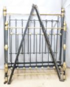 A 19th/20thC brass and iron double bed raised on ceramic castors, W140cm
