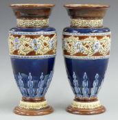 A pair of Royal Doulton pedestal vases initialled PB and MH to bases, H22cm