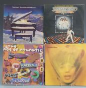Approximately 20 albums, mostly 1970s and 50 singles including David Bowie (9)
