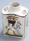 A late 18thC Prattware tea caddy with relief decoration of figures, probably King George III and