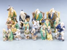 A quantity of Japanese figures, tallest 22cm