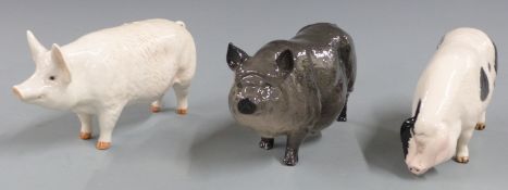 Three Beswick / Royal Doulton pigs including Gloucester Old Spot, tallest 9cm