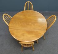 Ercol mid century / modern retro light elm table and four hoop backed chairs with 1970's cushions,