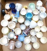 Approximately 40 novelty egg cups including Carltonware, Royal Doulton Bunnykins, retro