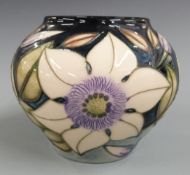 Moorcroft bulbous vase decorated with white passion flowers, H11, diameter 13cm, with box