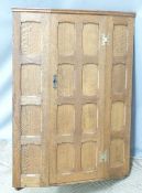 Arts and Crafts panelled oak peg jointed hanging corner cupboard, W67 x H86cm
