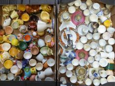 Approximately 70 novelty egg cups including Royal Albert, Spode Italian, Limoges, saucer types,