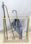 19thC/20thC stick stand with two hallmarked silver mounted sticks and an umbrella