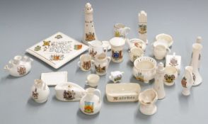 A collection of crested ware including Goss teapot stand