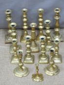 Six pairs of brass candlesticks and two odd examples, tallest pair 26cm