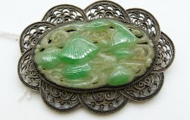 A silver filigree brooch set with carved jadeite, 5.5 x 4cm