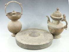 Three Chinese metal items comprising a water jug with ornate dragon handle, bat decoration to stem