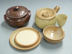 Eight pieces of Winchombe pottery including a goblet, some with stamps