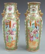 A pair of 19thC Chinese famille rose vases decorated with court scenes, Dog of Fo handles and