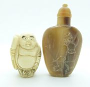 Chinese horn agate snuff bottle with engravings to front together with a netsuke