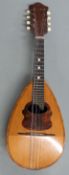 Late 19th/early 20thC flat back mandolin in brown block leather carry case