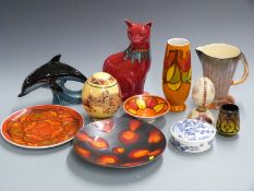 A collection of ceramics including Poole pottery cat and dolphin, decorated egg etc, tallest 30cm