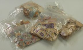 A quantity of loose Commonwealth stamps in packets sorted into reigns, together with a quantity of